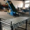 Unloader with powered conveyors each end