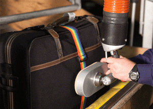 Vaculex Baggage Handling - Loading Baggage from Chute to Open Cart